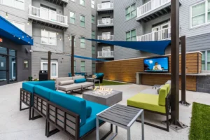 DA402189 kennesaw state apartments firepit lounge with outdoor flatscreen
